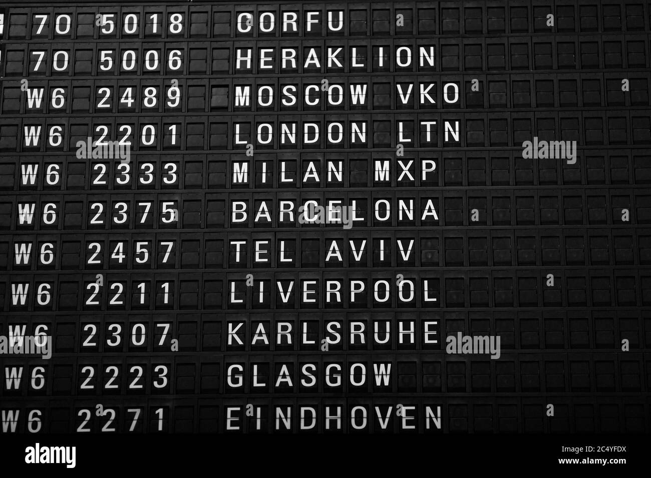 Departures board at the airport. Flight information mechanical