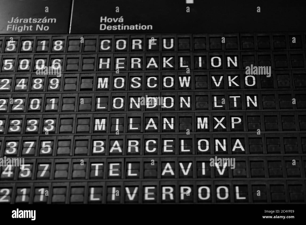 Departures board at the airport. Flight information mechanical