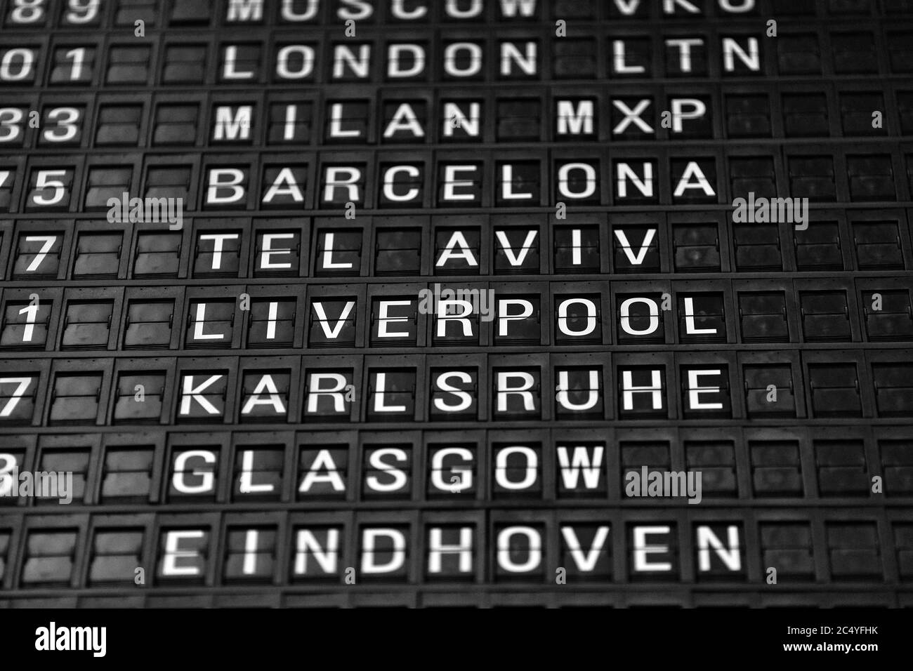 Departures board at the airport. Flight information mechanical
