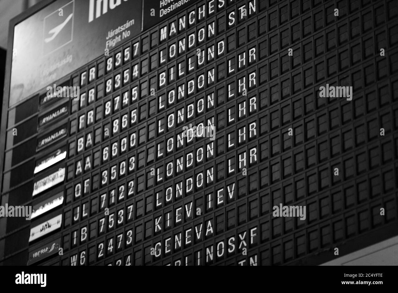 Departures board at the airport. Flight information mechanical ...