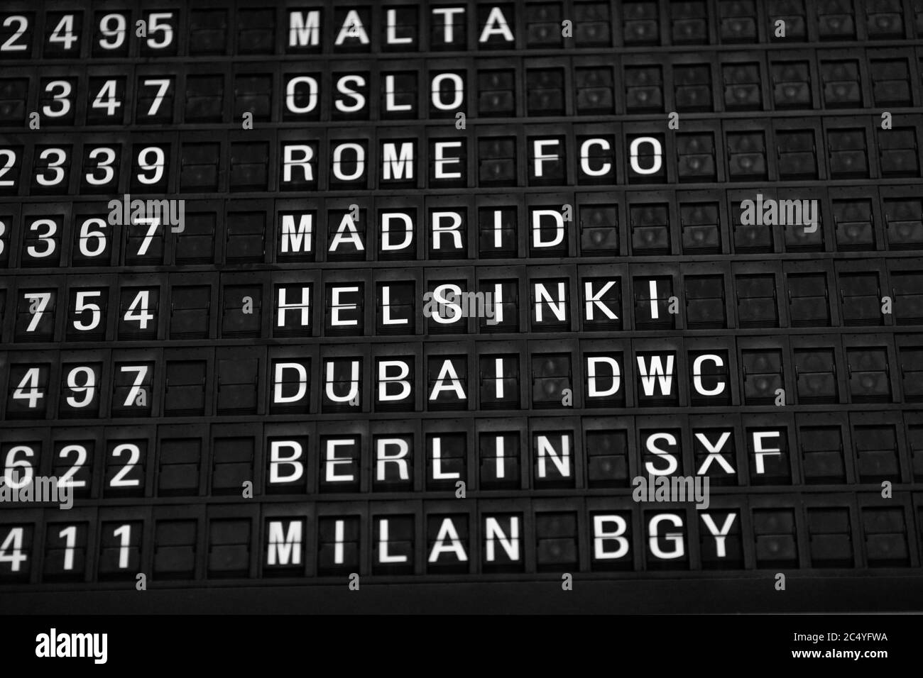 Departures board at the airport. Flight information mechanical ...
