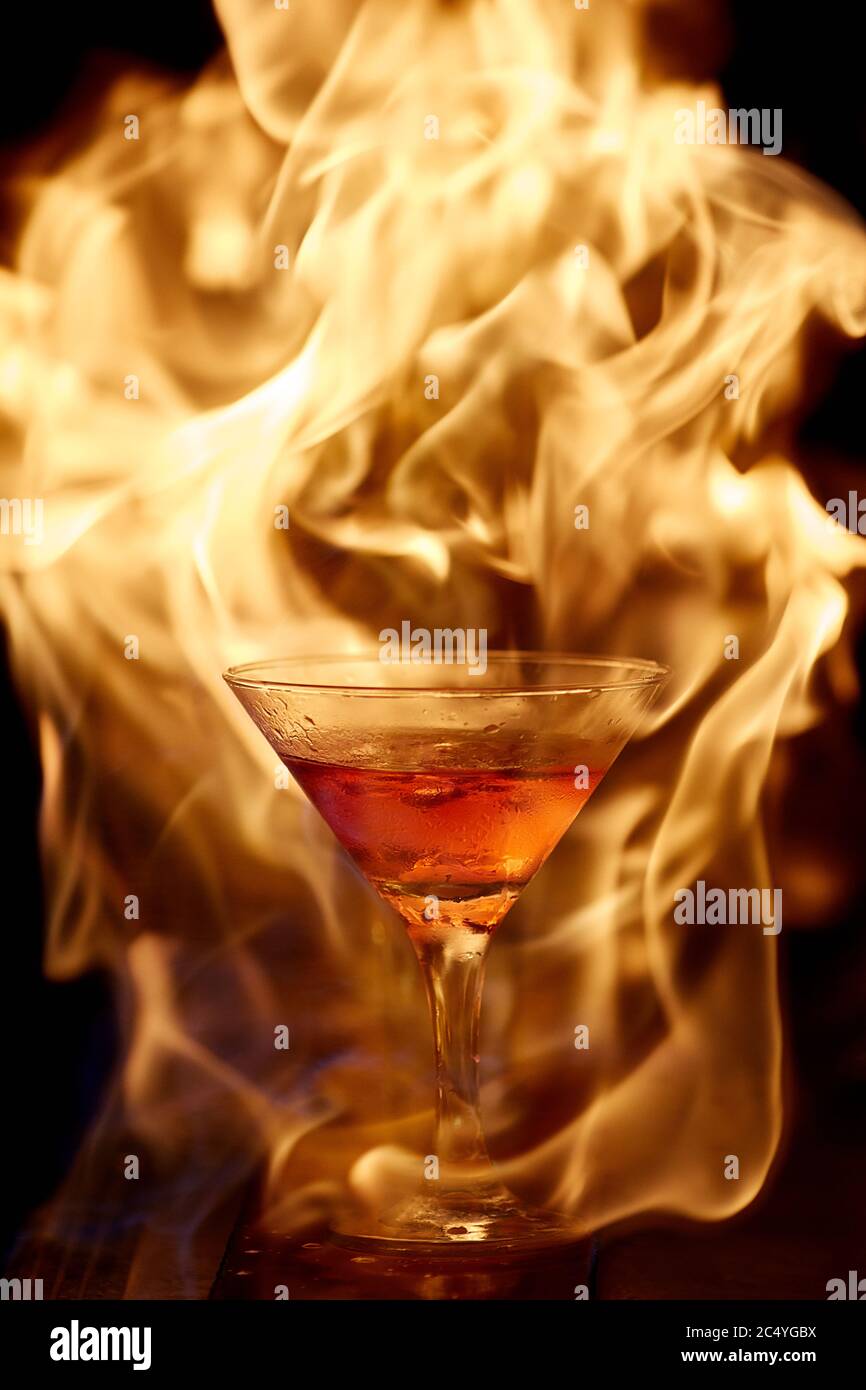 cocktail on fire. fiery cocktail. fire on the bar Stock Photo Alamy