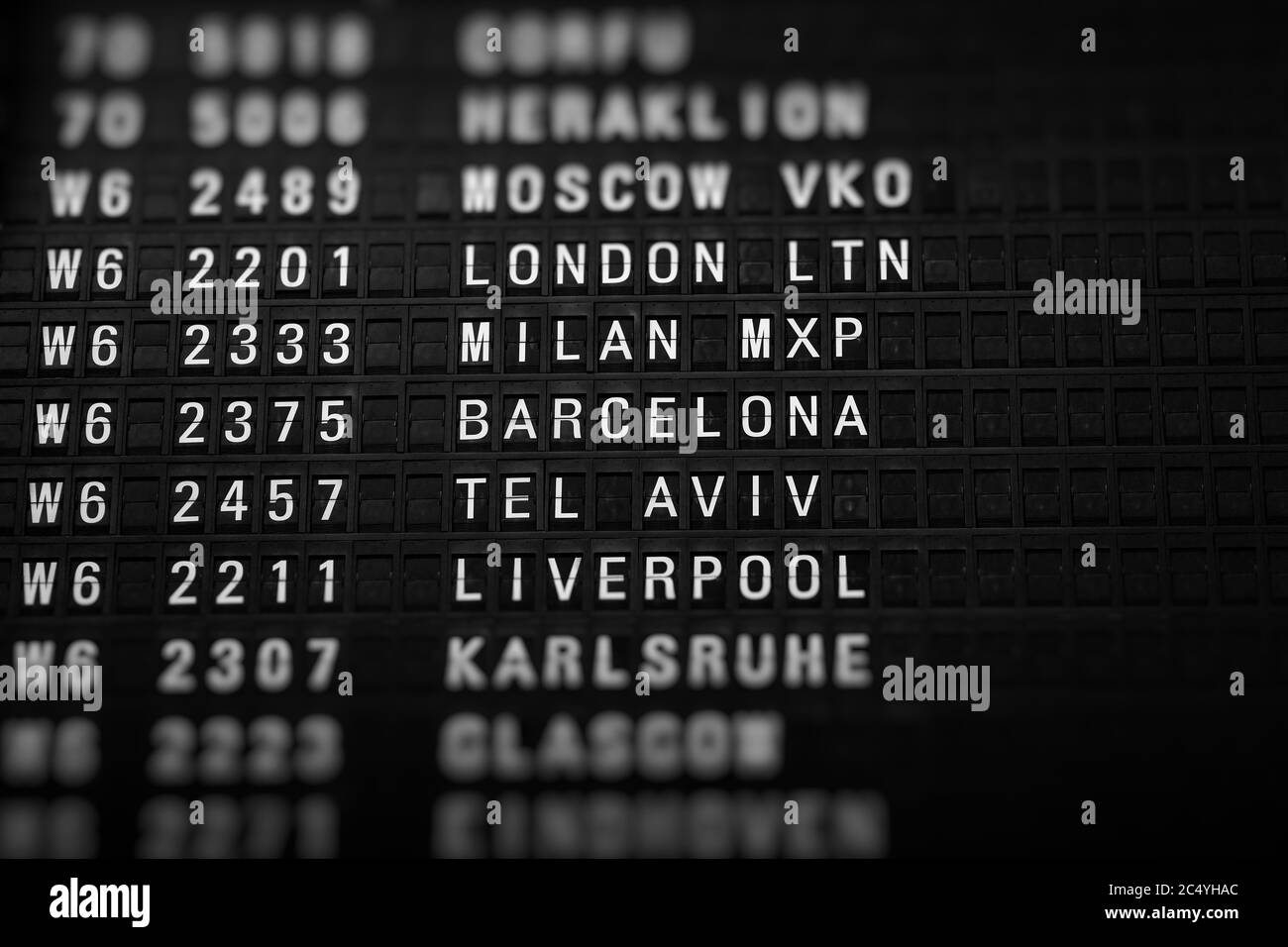Departures board at the airport. Flight information mechanical ...