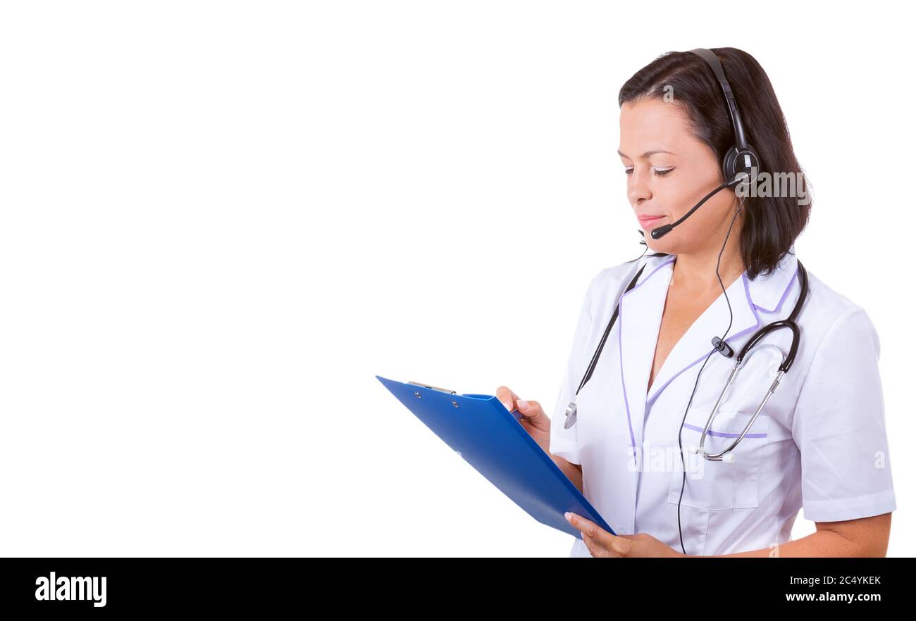 Medical Woman Doctor in Headset with Stethoscope Holding Clipboard with Copyspace for Yours Design on a white background Stock Photo