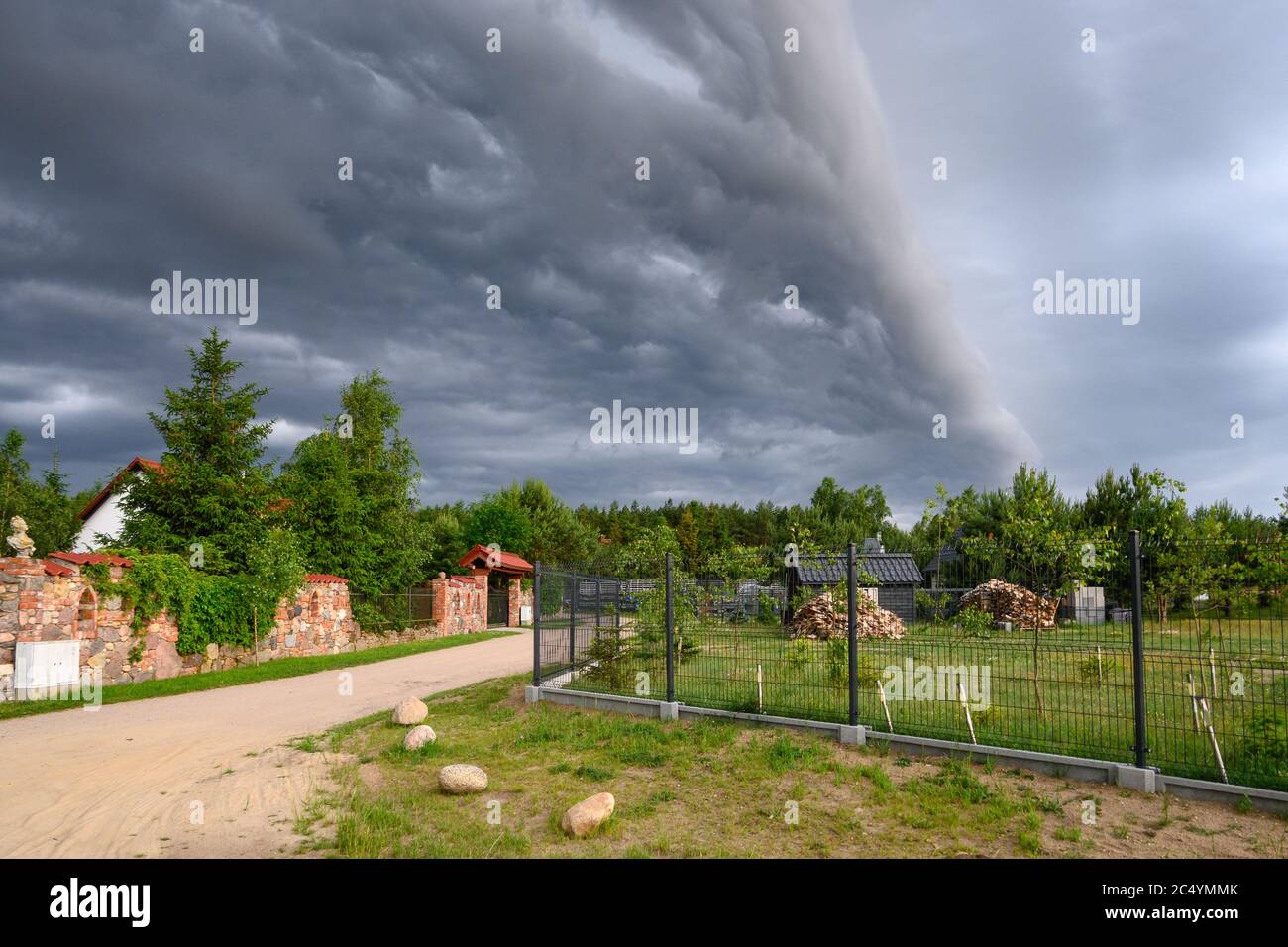 Dark and stormy clouds over the rural area Stock Photo - Alamy