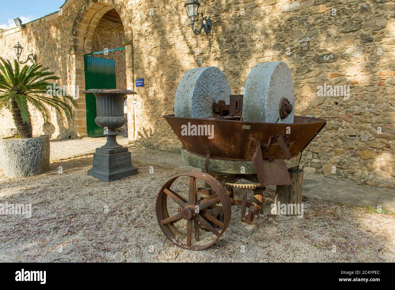 Old farming equipment on display of the hotel Agriturismo Gigliotto Piazza Armerina, which is an ancient XIII century farmhouse near Piazza Armerina o Stock Photo