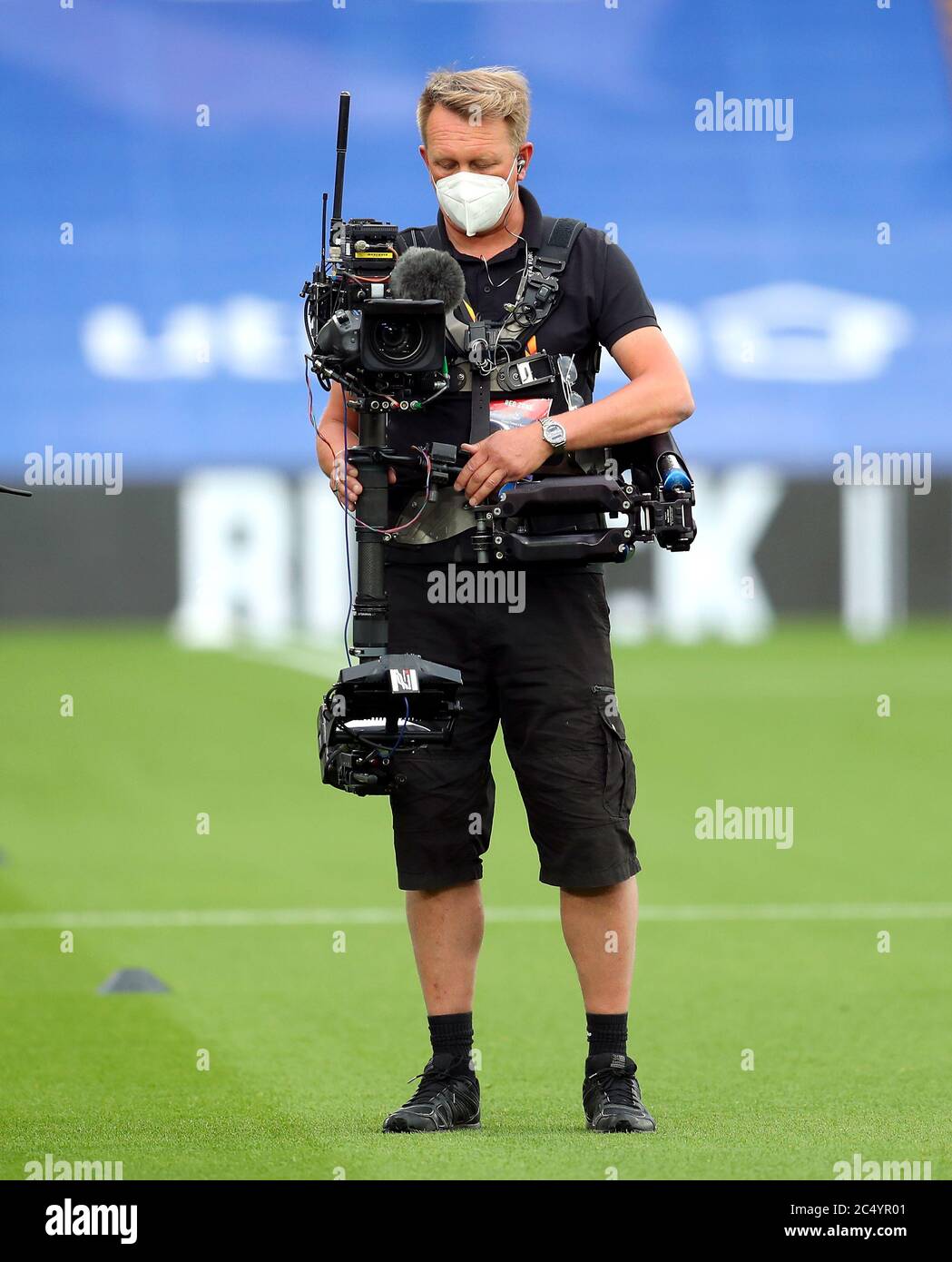 A steady cam operator wearing a mask before the Premier League match at  Selhurst Park, London Stock Photo - Alamy