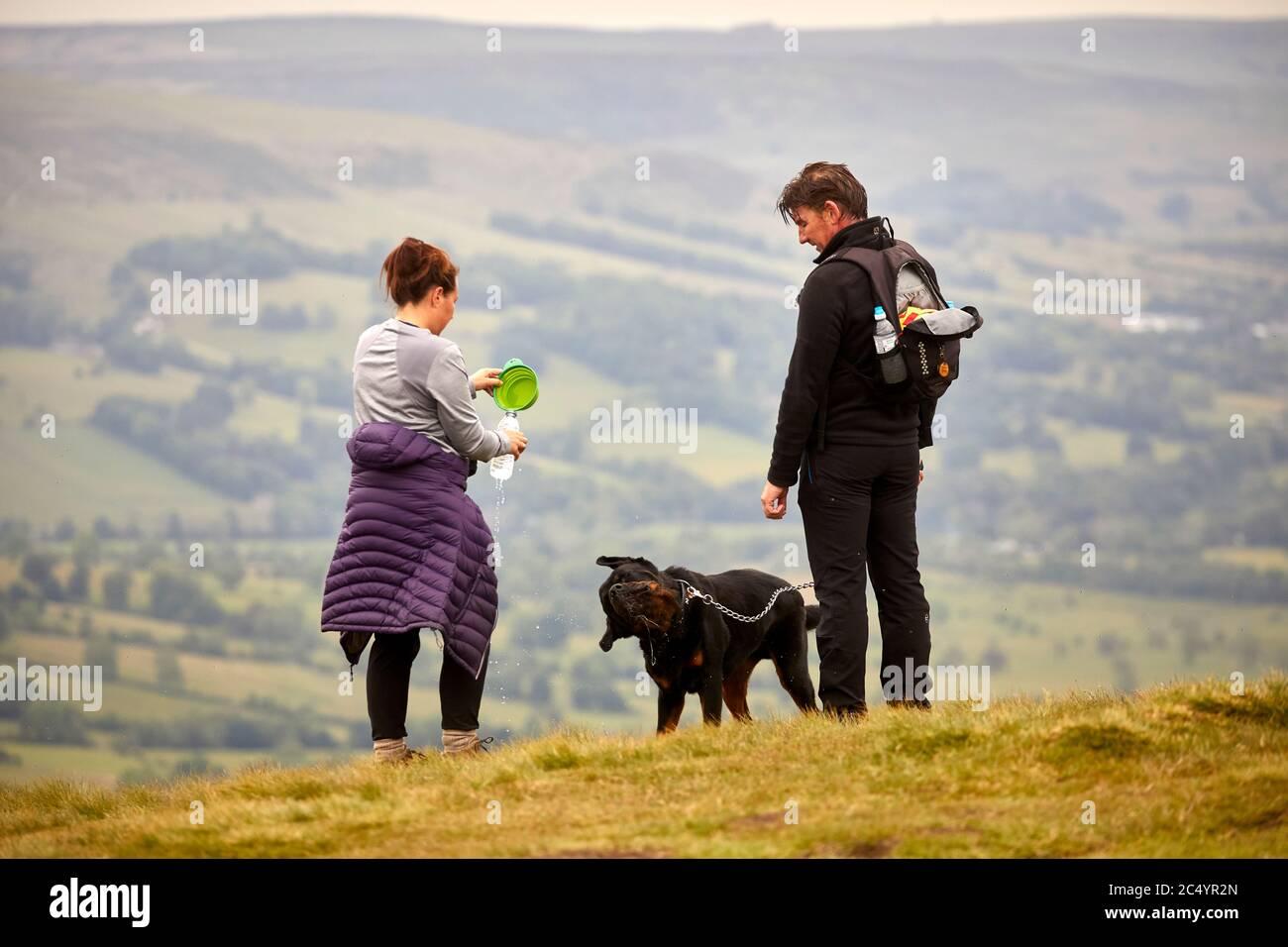 Dog walkers at Summit   Mam Tor hill near Castleton in the High Peak of Derbyshire, England Stock Photo