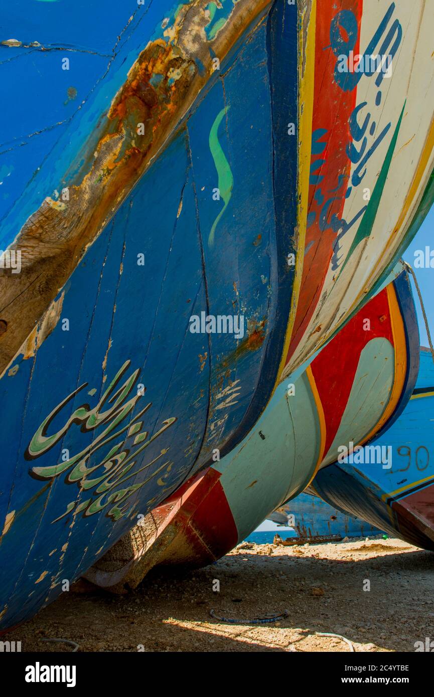 Seized wooden boats from Libya on which illegal migrants come to Europe in the harbor of Portopalo di Capopassero, a fishing community on the island o Stock Photo