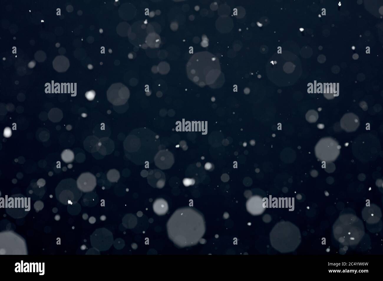 Snowfall on black background Stock Photo