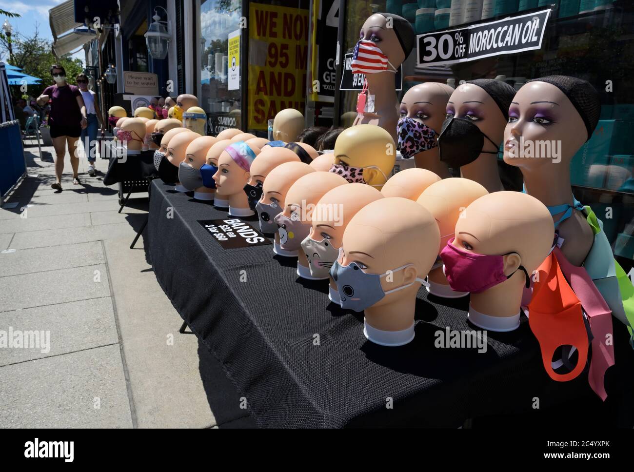 Corvid masks for sale, sidewalk outside store, NJ Stock Photo
