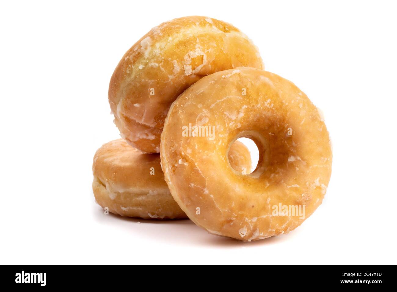 three honey dipped doughnuts in a pile isolated on white Stock Photo ...