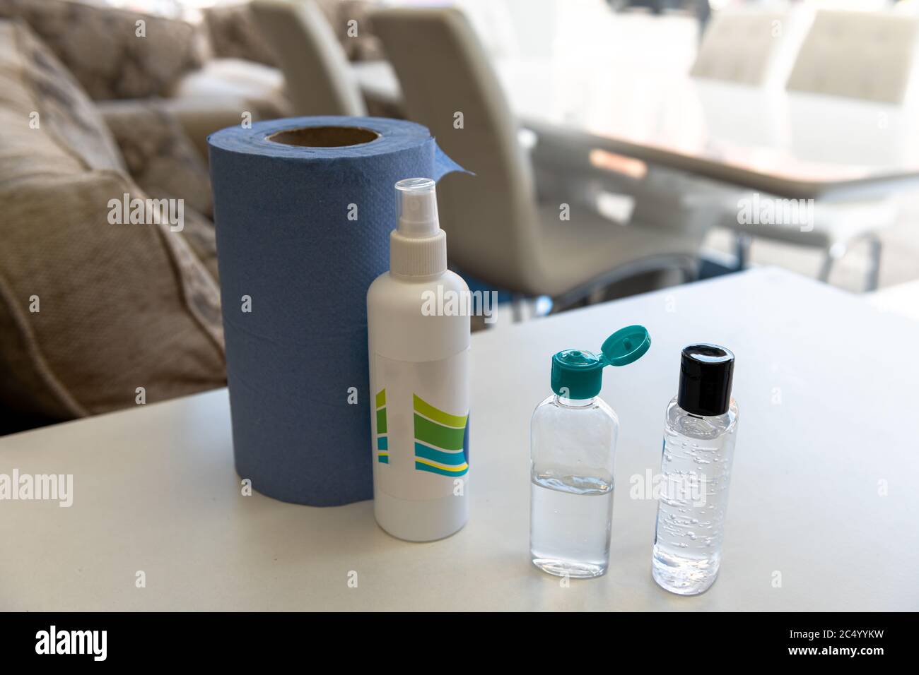 Anti bacterial hand gel and disinfectant by the entrance of a high street retailer. Stock Photo