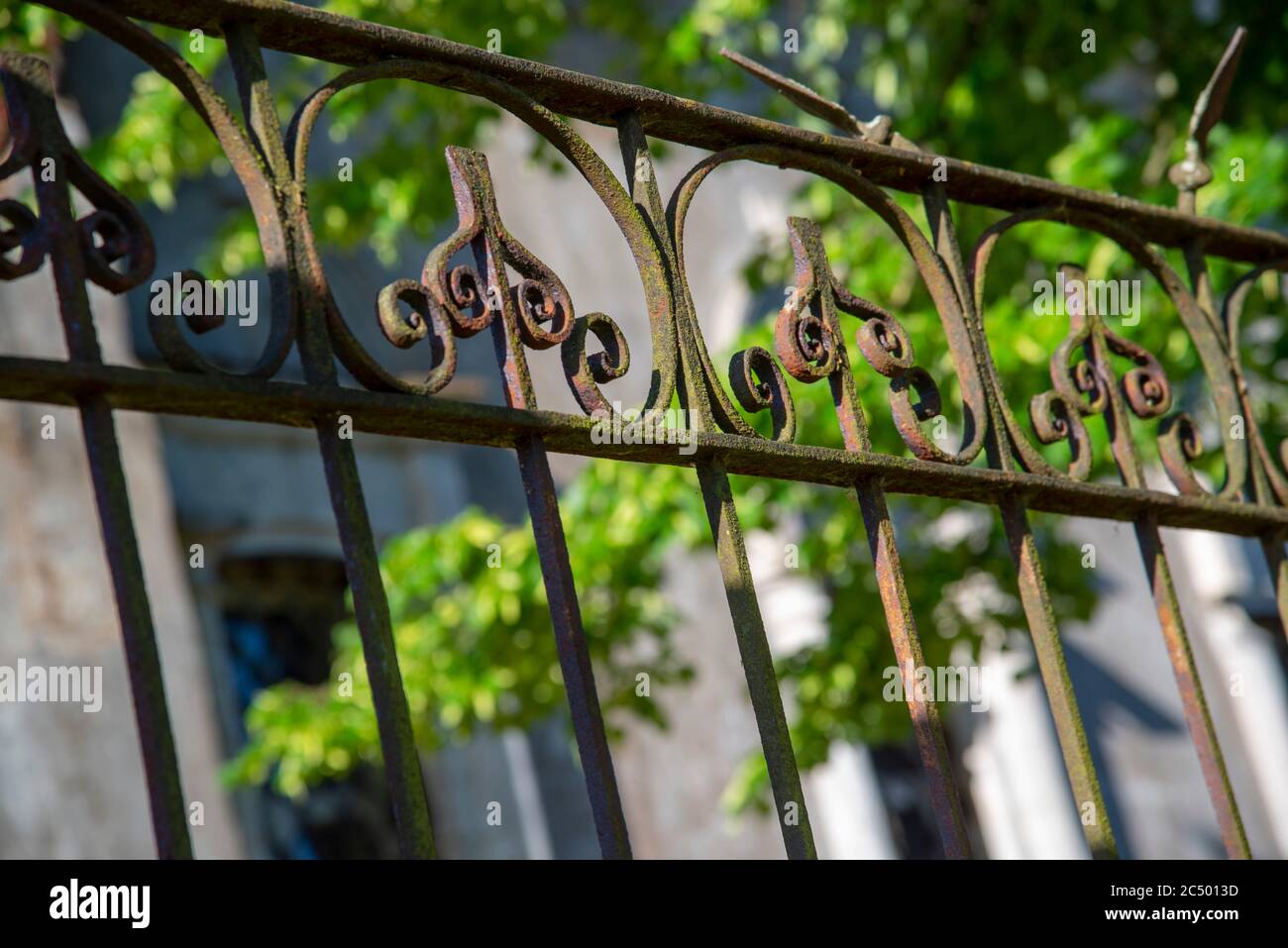 A fragment of a metal fence rusted with time Stock Photo Alamy