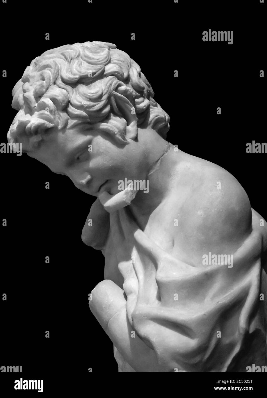 Black and white photo of young boy in profile sculpted on marble Stock Photo