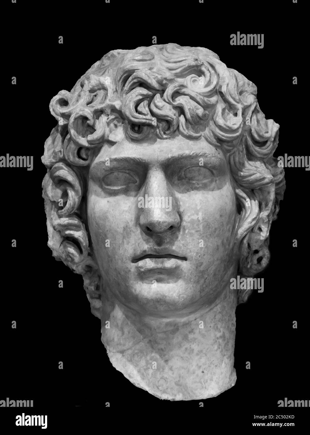 Black and white photo in close-up on face of handsome young man sculpted on marble Stock Photo