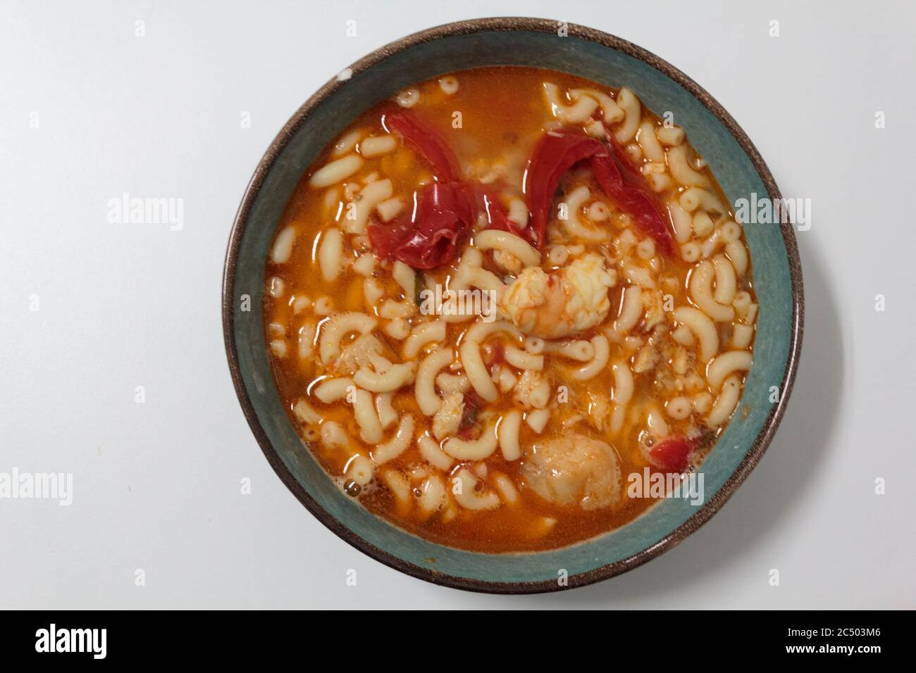 Bowl with Fish pasta soup. A Portuguese typical dish called massada de peixe Stock Photo