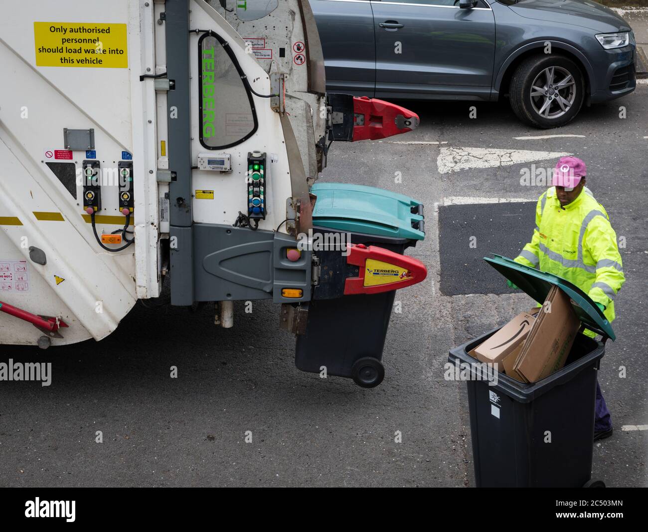 Workers of the company Veolia, a waste management company, making a waste collection. Stock Photo