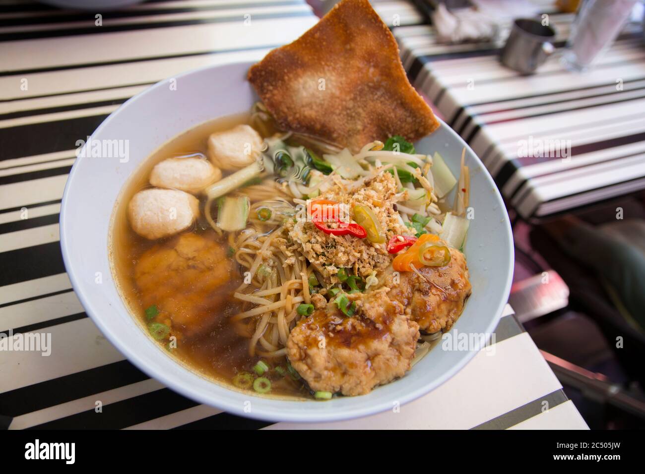 Kway Tiew Gai Traditional Thai Noodles Soup Containing Rice Noodles Chicken Balls Fish Balls Crispy Garlic Sprouts Peanuts And Crispy Wonton Stock Photo Alamy
