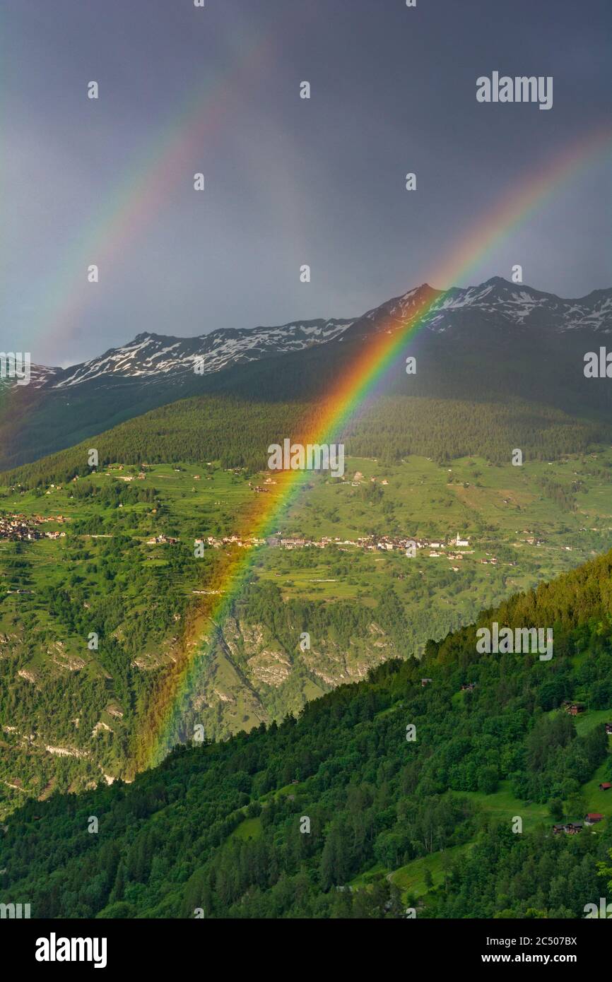 Switzerland, Valais Canton, Val d'Heremence, double rainbow Stock Photo