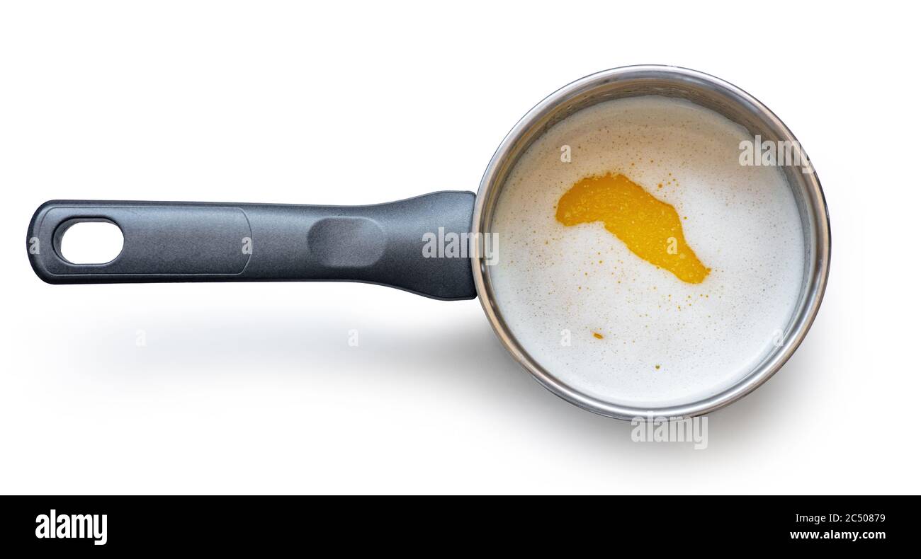 melted butter in saucepan isolated on white background, top view Stock Photo