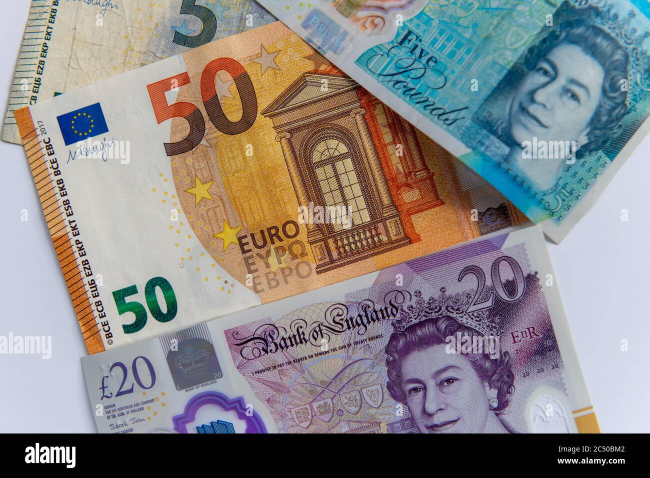The five and twenty British Pound bank notes and the five and fifty Euro bank notes. Stock Photo
