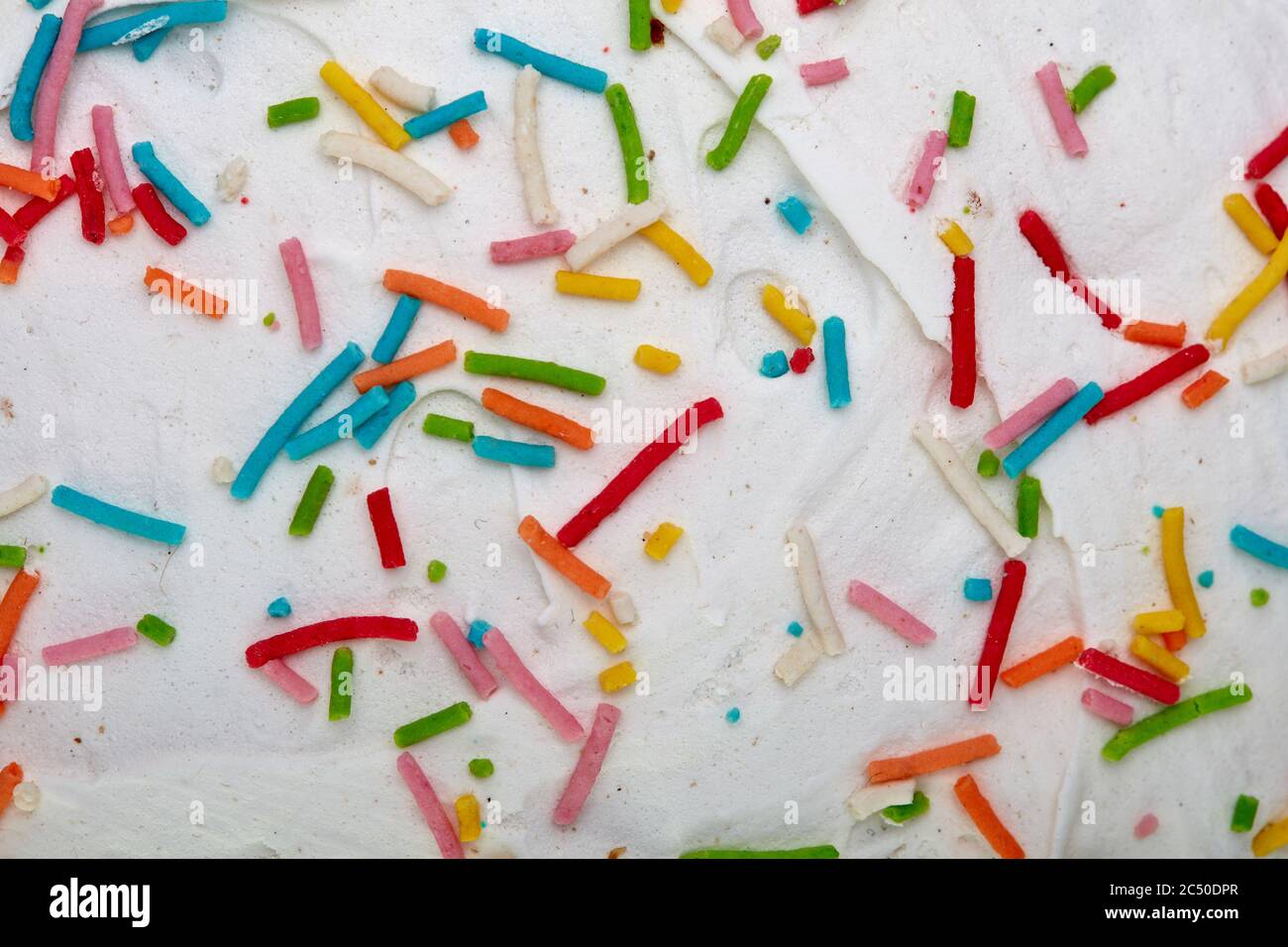 Candy sprinkles confetti. Sugar sprinkle dots. Sweet confetti on white