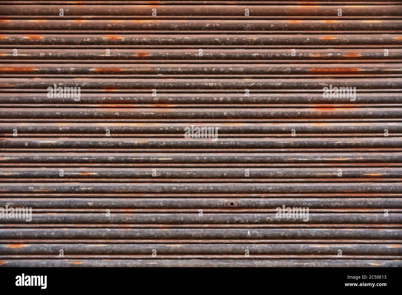 Old Roll-up Garage Gate. Old rusty garage doors. Stock Photo