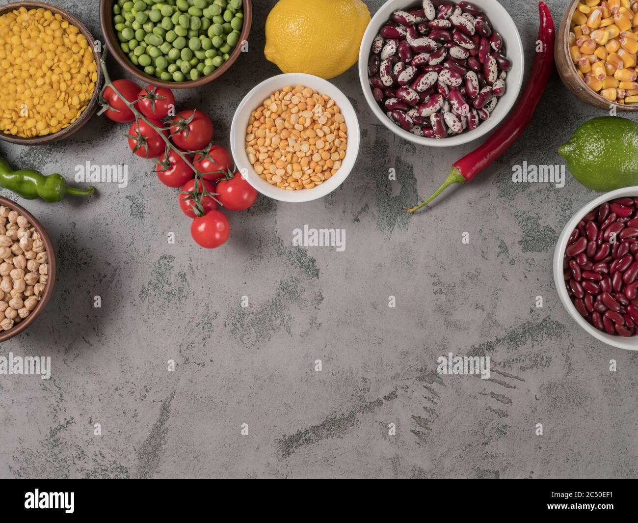Set beans and healthy vegetables for cooking. The gray background. Stock Photo