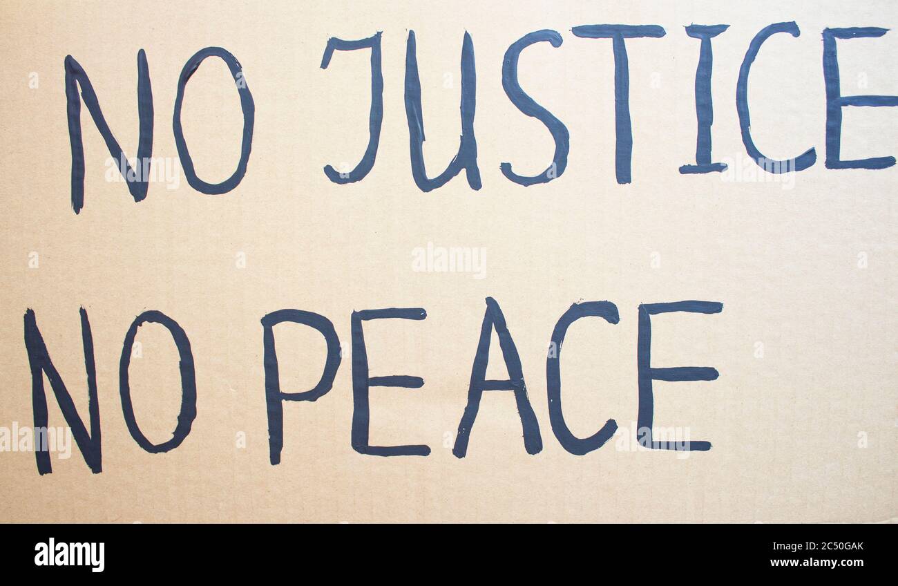 NO JUSTICE NO PEACE. Text message for protest on cardboard. Stop racism. Police violence. Banner Design concept. Stock Photo