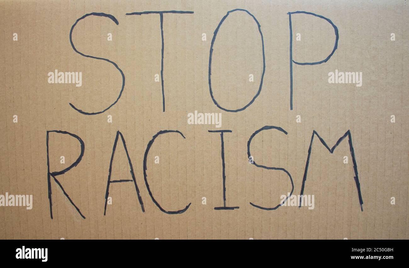 STOP RACISM. Text message for protest on cardboard. Stop racism. Police violence. Banner Design concept. Stock Photo