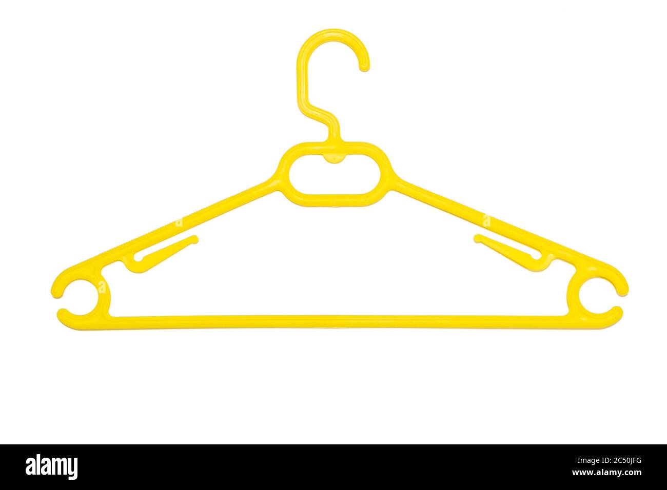 A yellow plastic coat hanger isolated on white background. Stock Photo