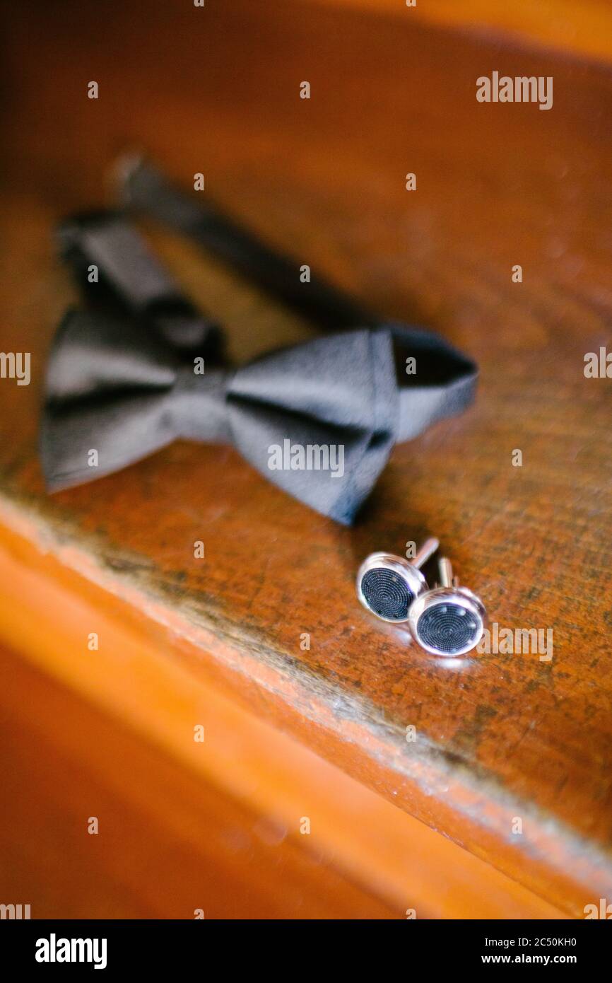 Bow tie and cufflinks. Preparations for the wedding day. Stock Photo