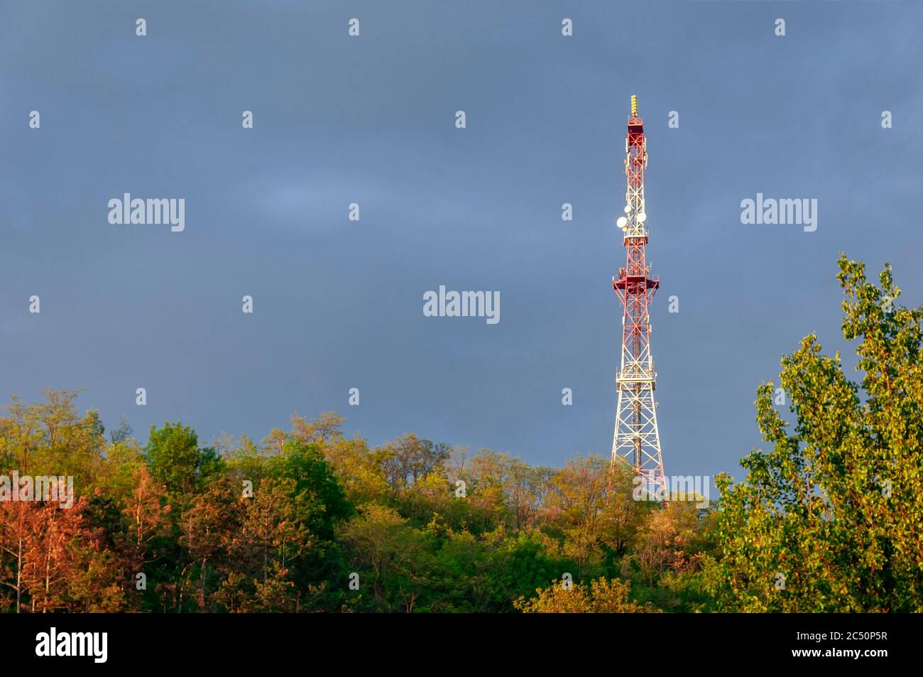 radio tower on stormy sky background, dark clouds Stock Photo