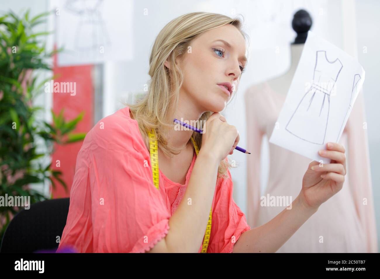 a woman looking at drawing Stock Photo