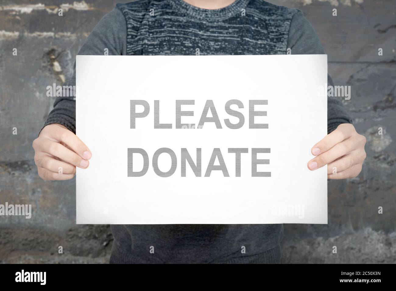 Hand Holding Please Donate Sign Stock Photo 191669165