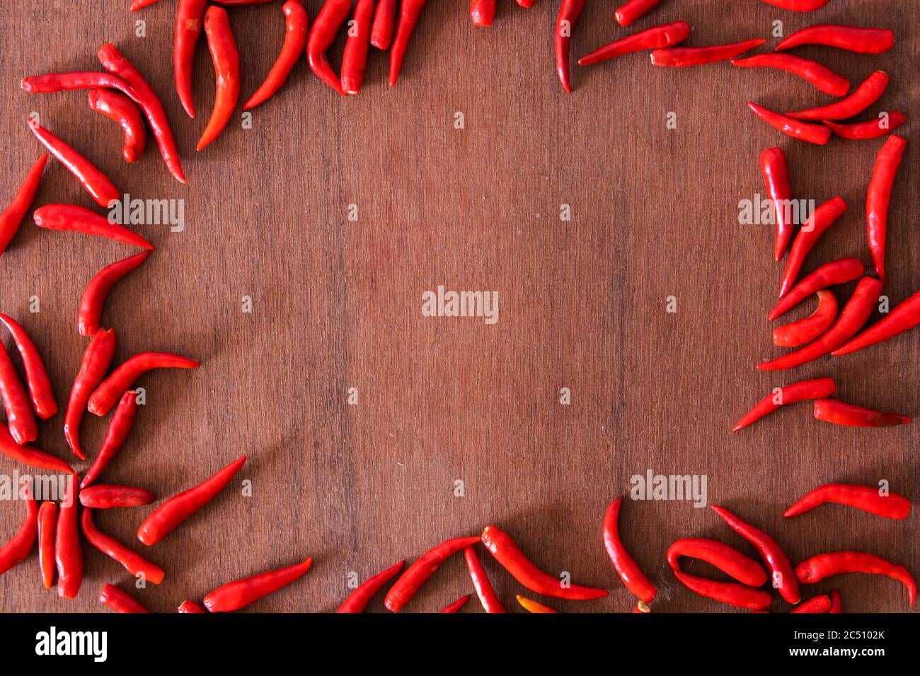 Red peppers on the wood floor,Free space Enter text and images. Stock Photo