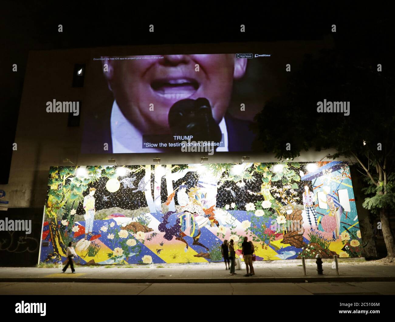 New York, United States. 30th June, 2020. An Anti-Trump ad related to the Coronavirus pandemic appears above the Bowery Mural on Bowery Street in New York City on Monday, June 29, 2020. Bowery Mural is an expansive outdoor wall showcasing creative, contemporary murals that change regularly. Photo by John Angelillo/UPI Credit: UPI/Alamy Live News Stock Photo