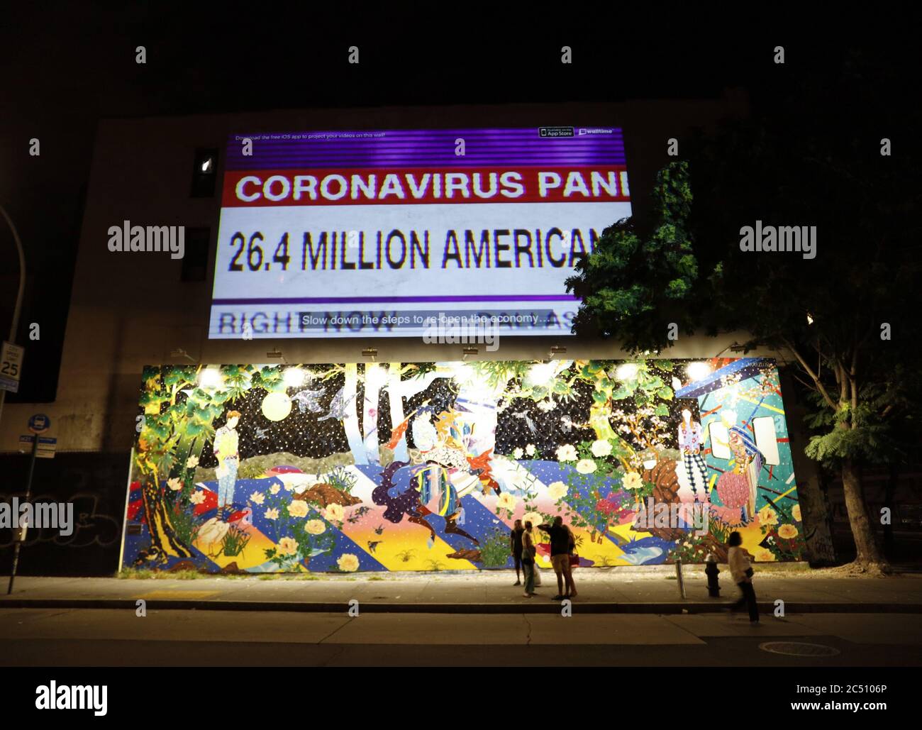 New York, United States. 30th June, 2020. An Anti-Trump ad related to the Coronavirus pandemic appears above the Bowery Mural on Bowery Street in New York City on Monday, June 29, 2020. Bowery Mural is an expansive outdoor wall showcasing creative, contemporary murals that change regularly. Photo by John Angelillo/UPI Credit: UPI/Alamy Live News Stock Photo