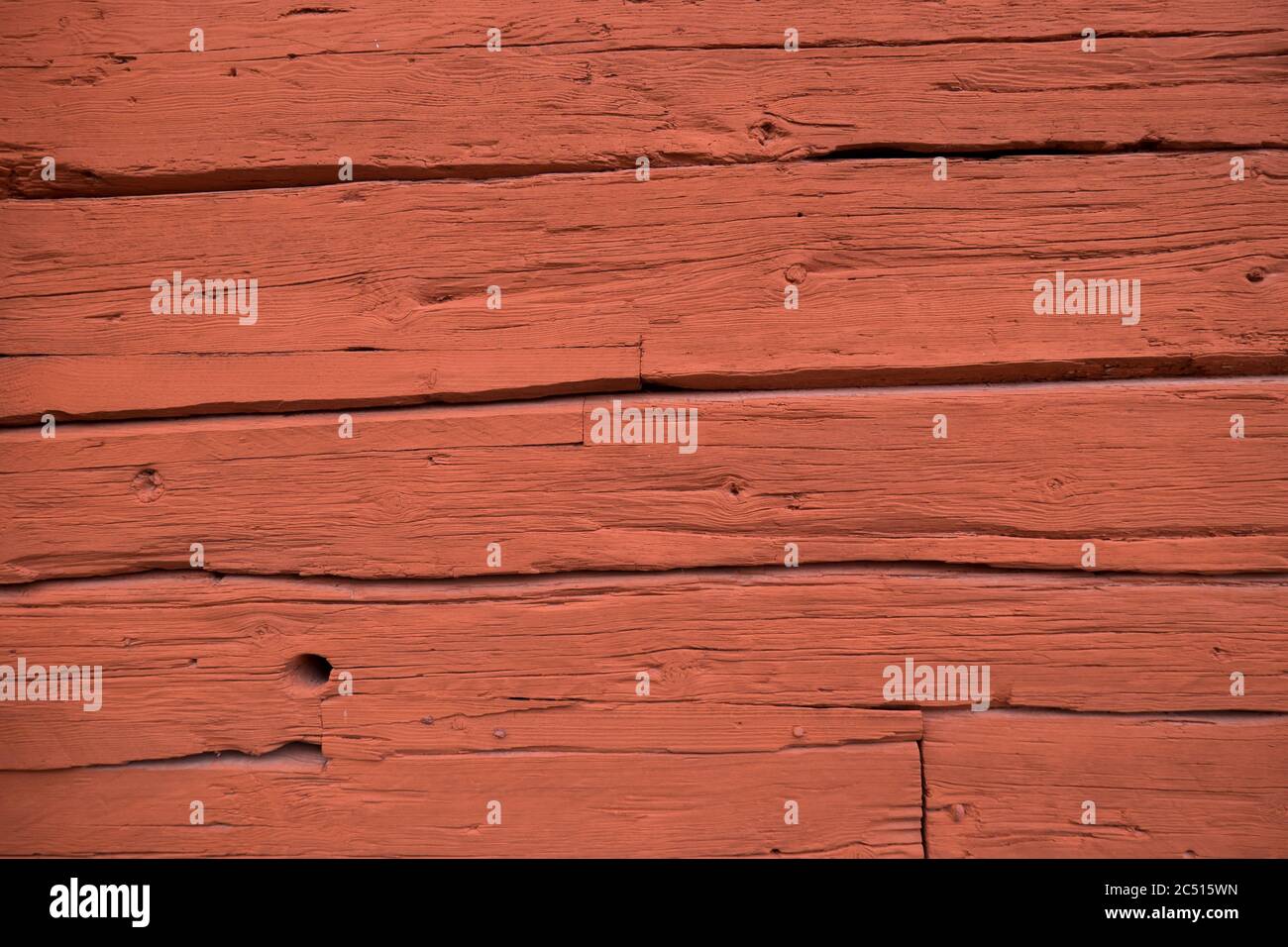 Wooden boards of a cottage with deep Falu red or falun red paint, well known for its use on wooden cottages and barns in Sweden and Finland Stock Photo