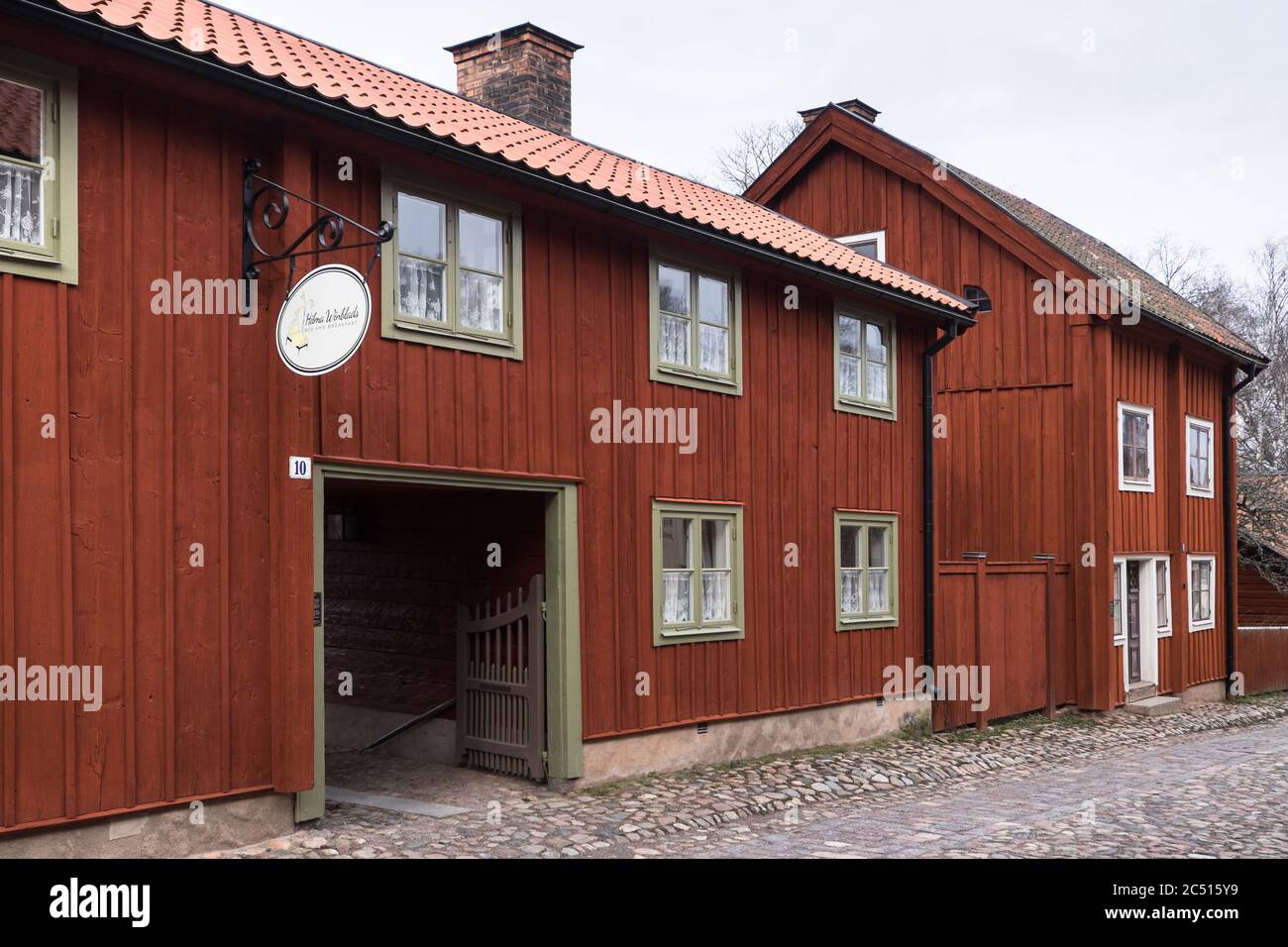Traditional timber houses with deep Falu red or falun red paint in the
