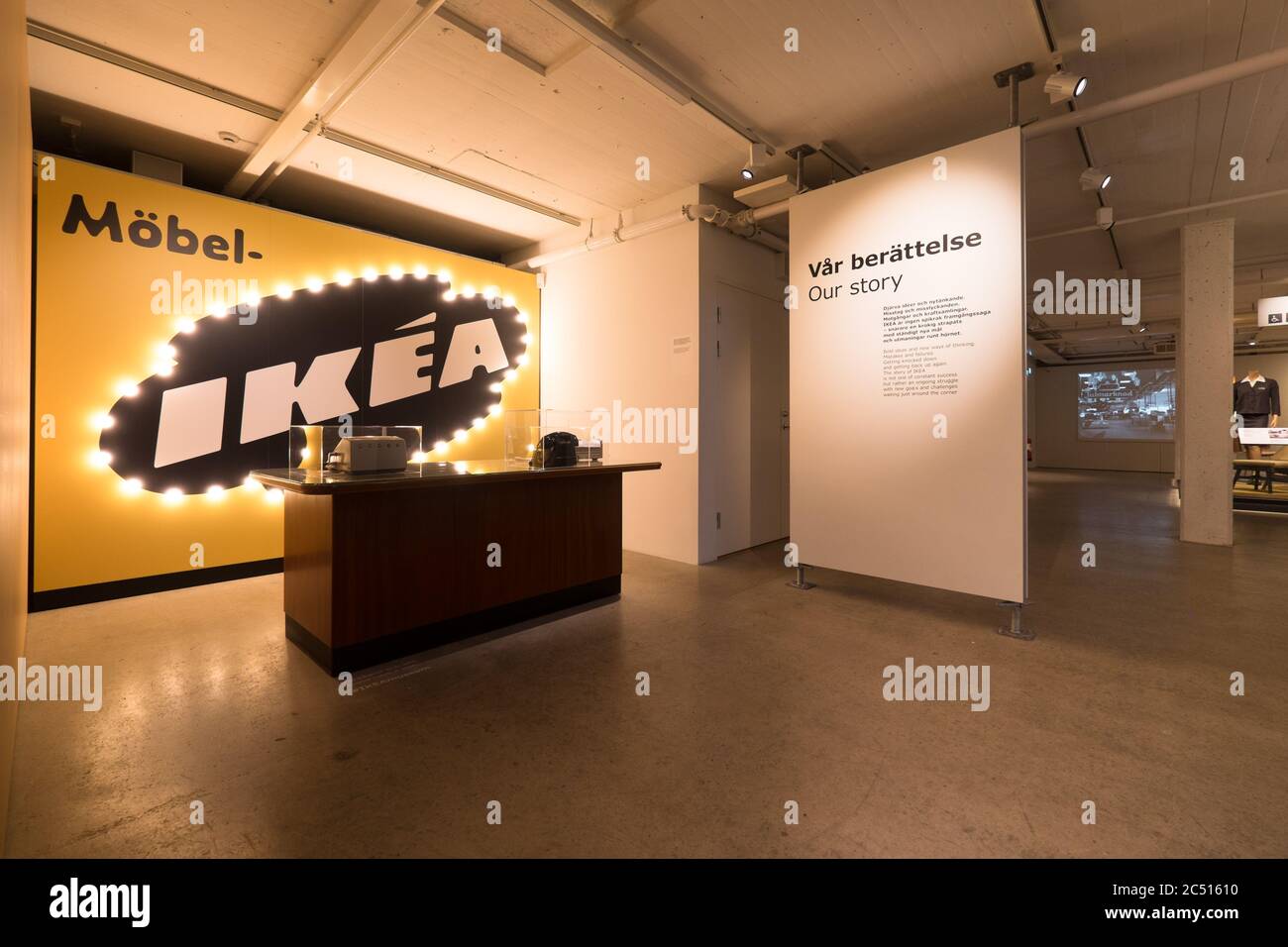 Interior of the IKEA Museum in Almhult. The logo dates from 1954. The only non-IKEA piece of furniture in the IKEA Museum: the old desk by the founder Stock Photo