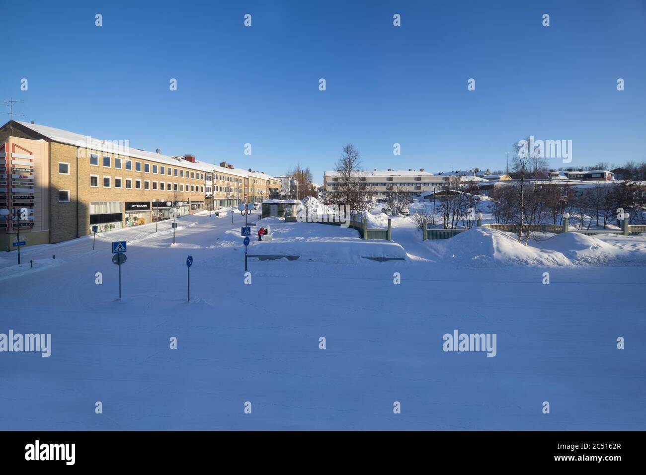 View of the center with shops and houses in winter in Kiruna, Lapland, Sweden. The city will be partially demolished and rebuilt two miles away Stock Photo