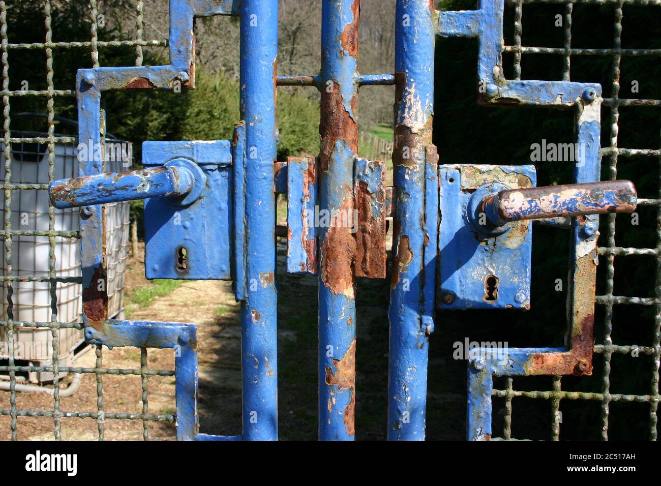old metal gate painted with blue color Stock Photo - Alamy