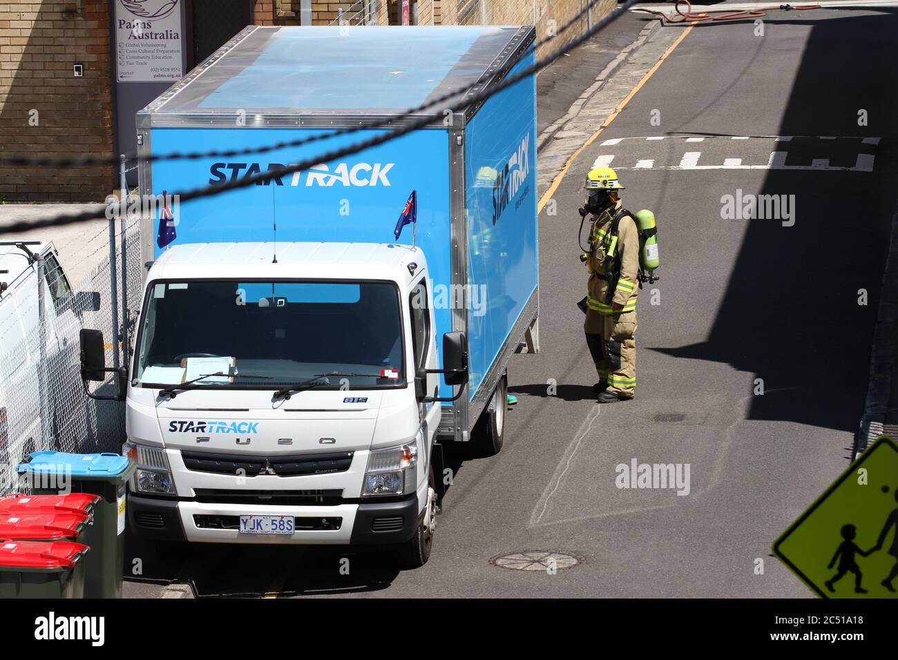 The Star Track truck parked on St James Lane in Glebe is attended to by ...