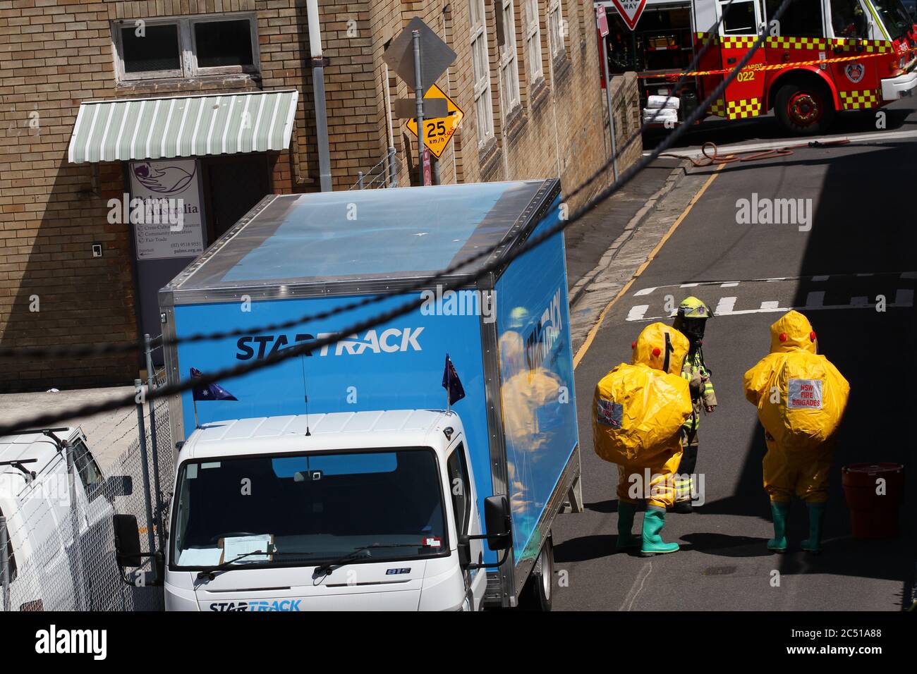 NSW Fire Brigade attend to the spill on St James Lane in Glebe Stock ...
