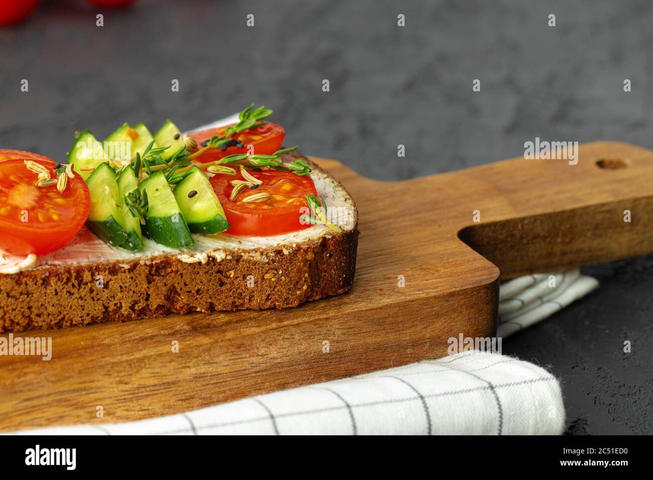 Rye bread sandwich with slices of tomatoes and cucumbers Stock Photo