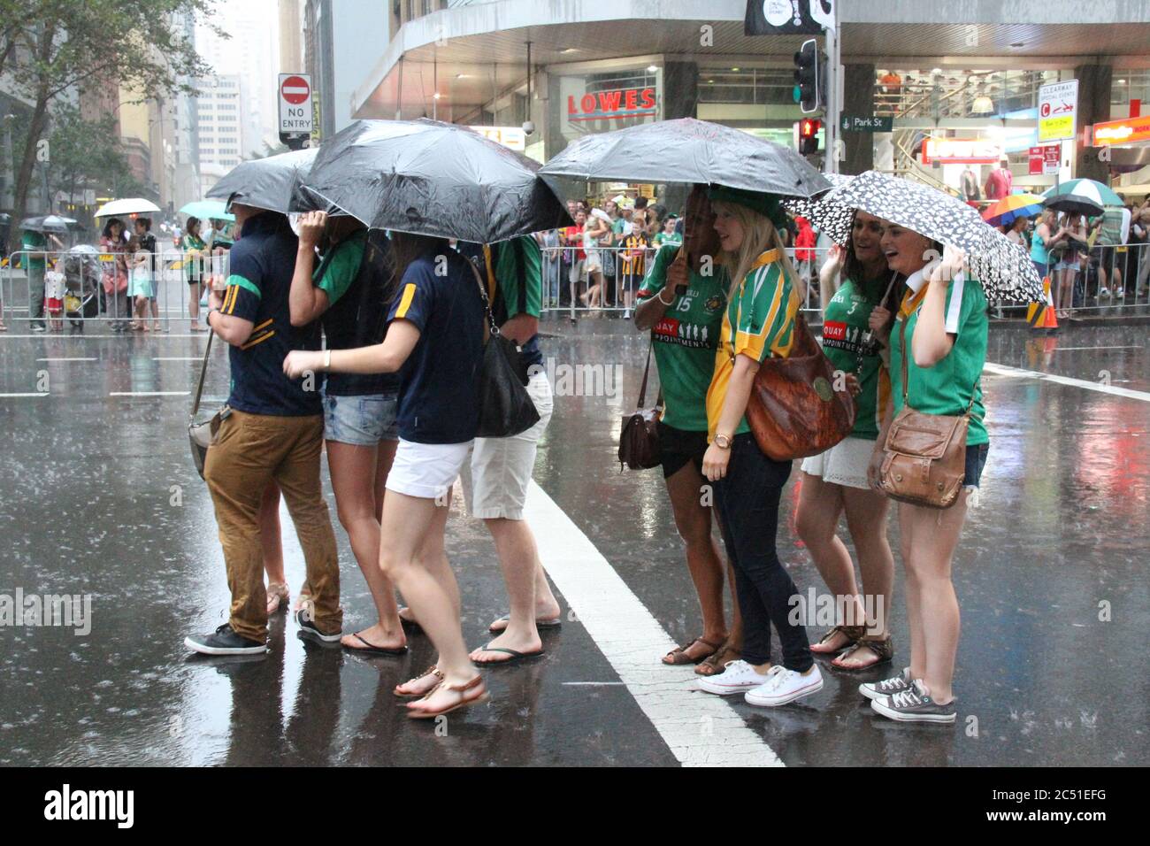 People taking part in the St Patrick’s Day Parade in Sydney get rain as ...