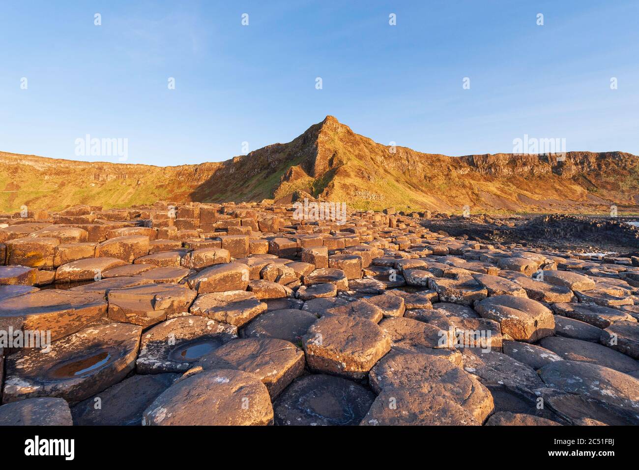 Basalt columns of the Thulean Plateau visible at the Giant's Causeway on the Causeway Coast of County Antrim in Northern Ireland Stock Photo