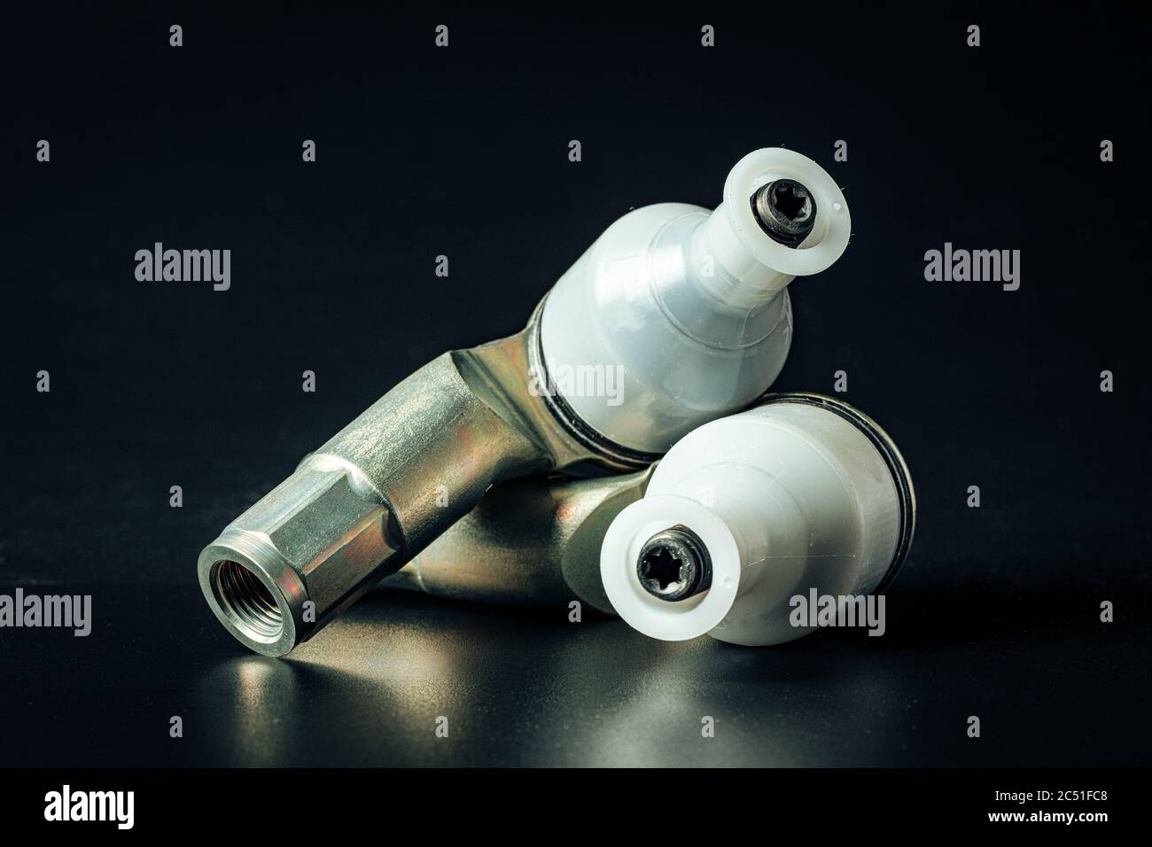 Car steering rod tip on black background Stock Photo Alamy